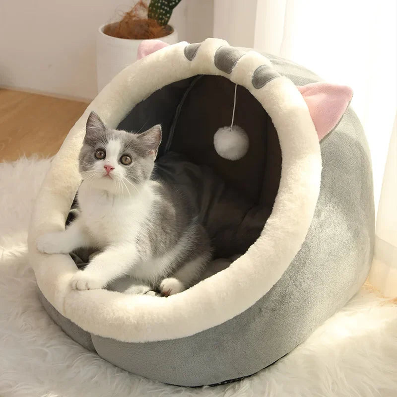 Cama toca premium para gatos e cães pequenos com almofada macia, brinquedo suspenso e design aconchegante para descanso e diversão.